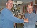 Winning captain Johnny ALvis receives the trophy from Marshall Clements